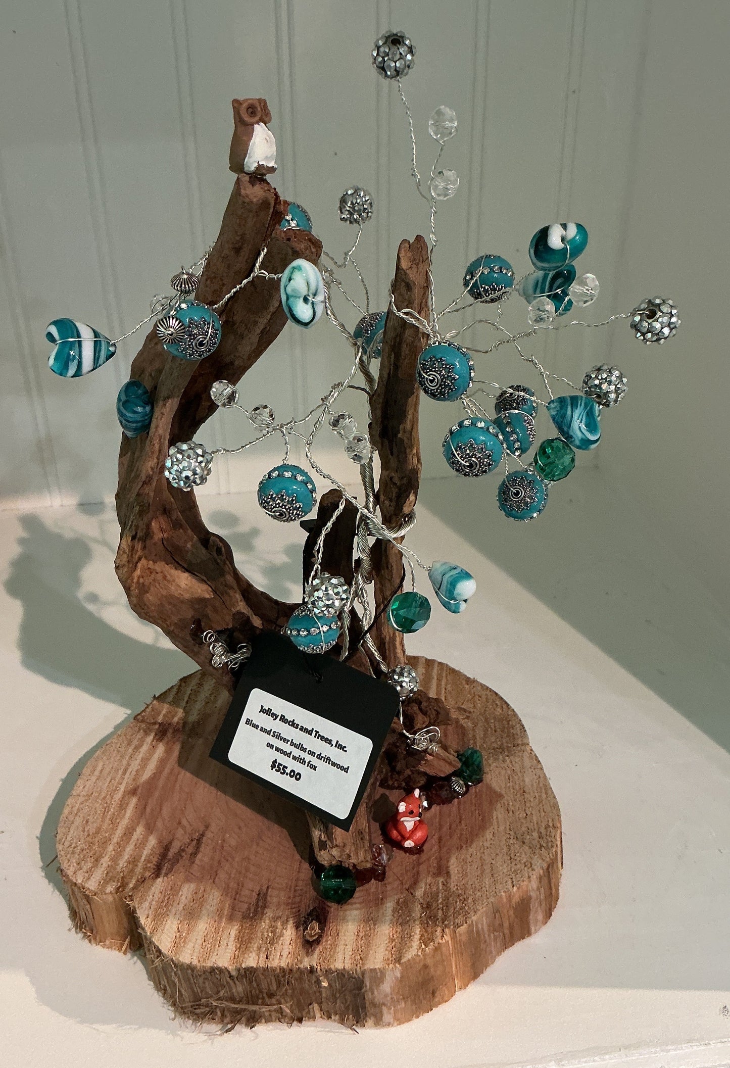 Blue and Silver Bulbs on Driftwood on Wood with Fox