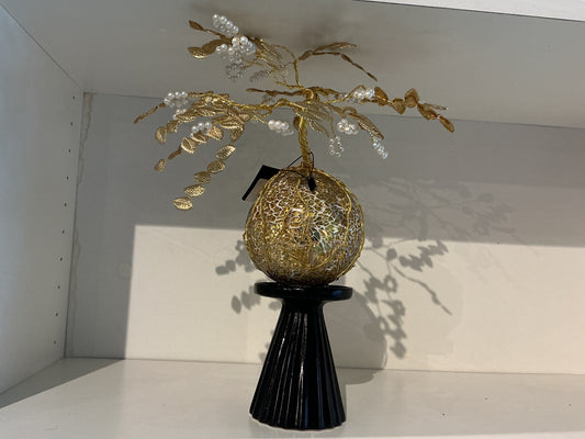 Gold leaves on gold orb