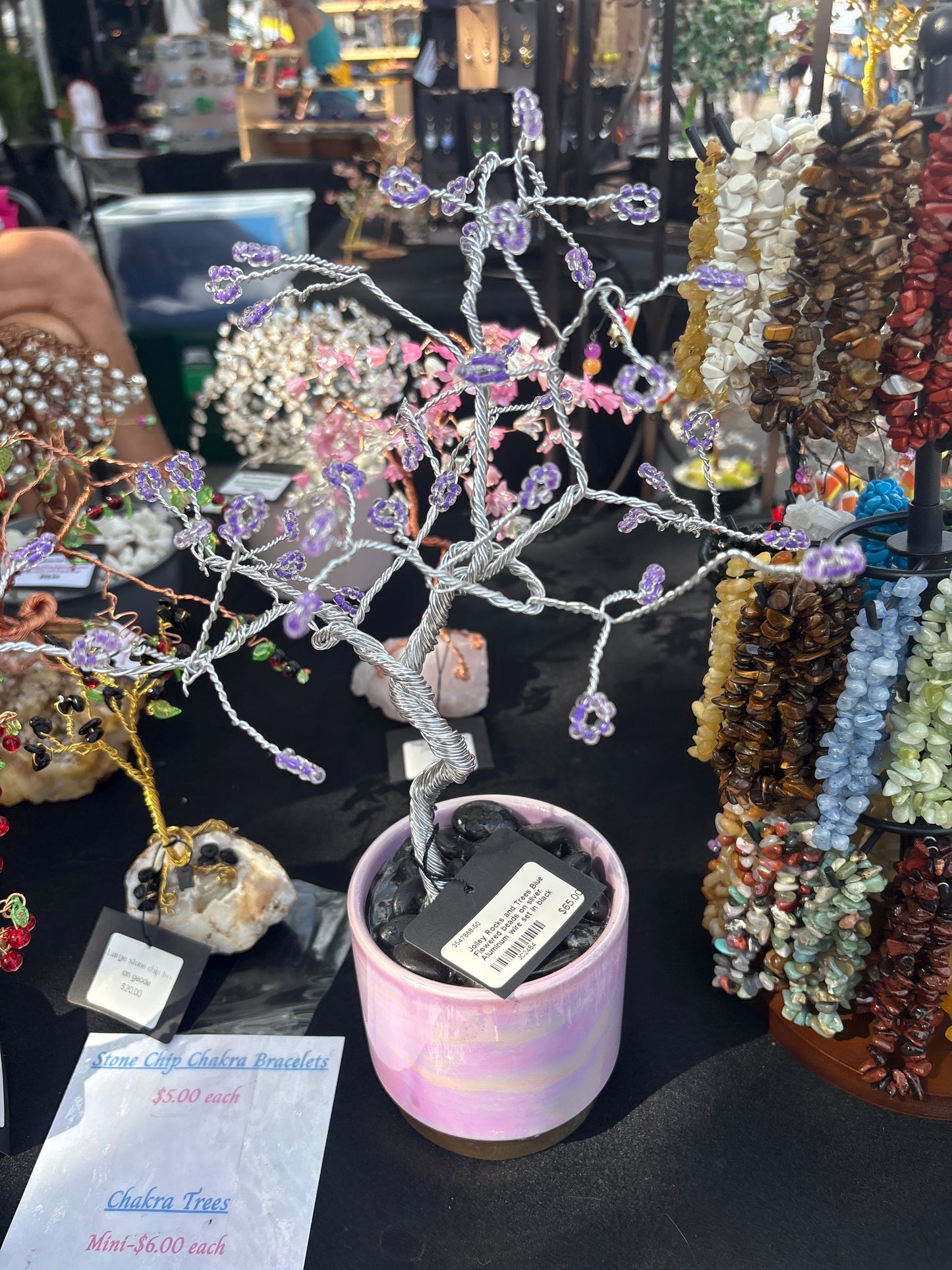 Purple beads set in  black pink vase