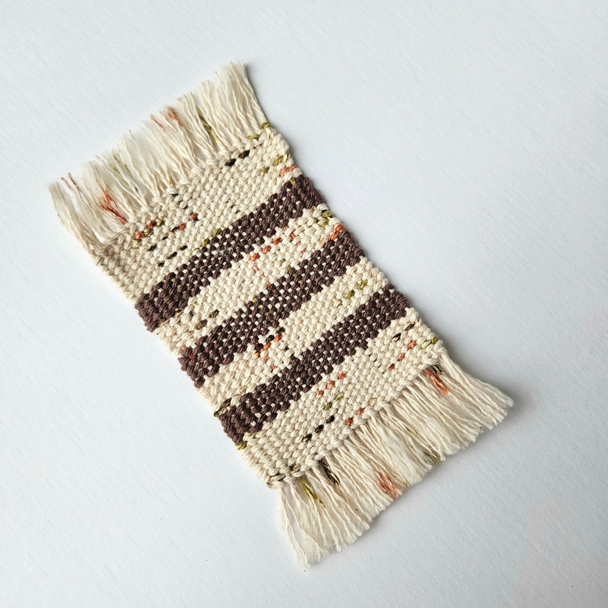 Handwoven Mug Rug Coaster. Thursday, November 5. 5-7pm. Art Guide: Amanda Wedemeyer
(Beginner)
Intro to weaving, all supplies included. Pick your colors and create a fun rug for your mug! Ages 18+